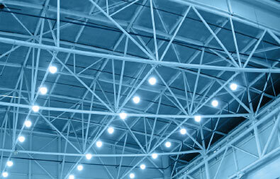 High-performance industrial lighting illuminating a large warehouse for improved safety and efficiency.
